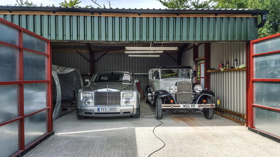 Bramwith and Rolls Royce on display in garage having maintenance work custom built vehicles.